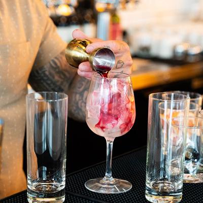 Hands preparing drinks.