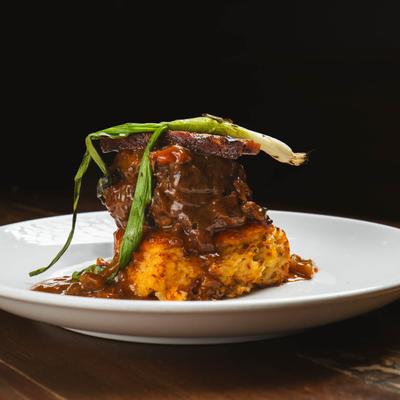 Braised short rib on hash brown casserole.