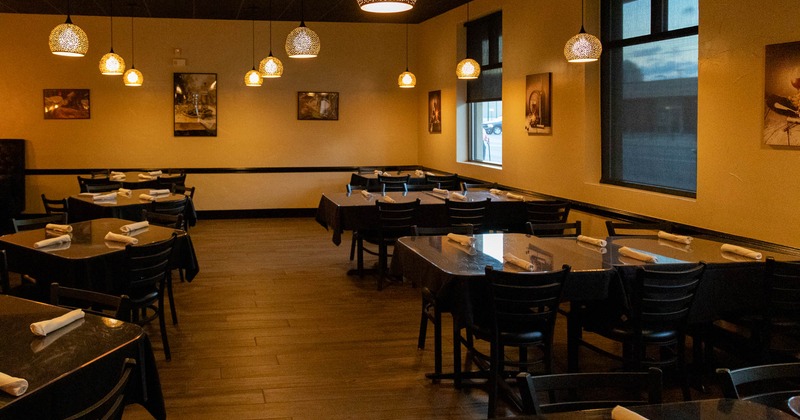 Interior, seating area  with tables and chairs waiting for the guests