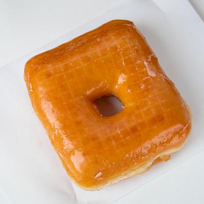 A square-shaped glazed donut.