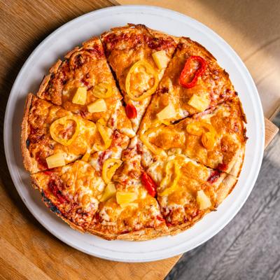 Maui Wowie pizza with pineapple, bacon and peppers.