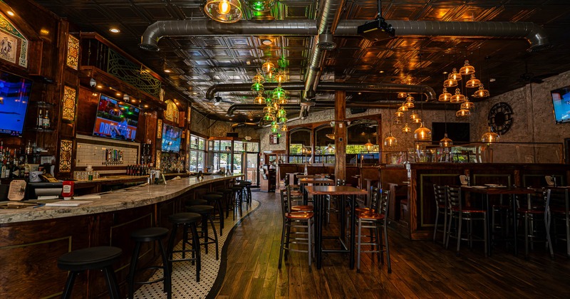 Interior, main seating and bar with stools on the left side
