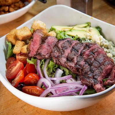The grilled steak salad, served.