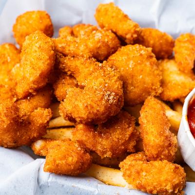Breaded shrimp and fries basket.