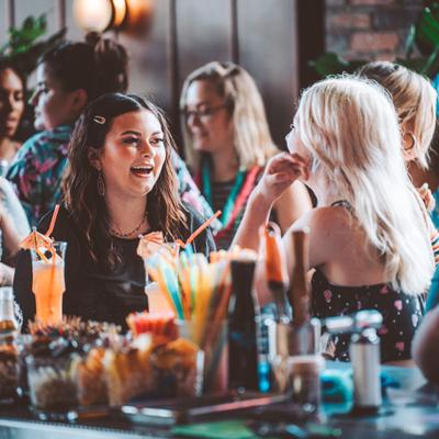 Guests chatting at the bar