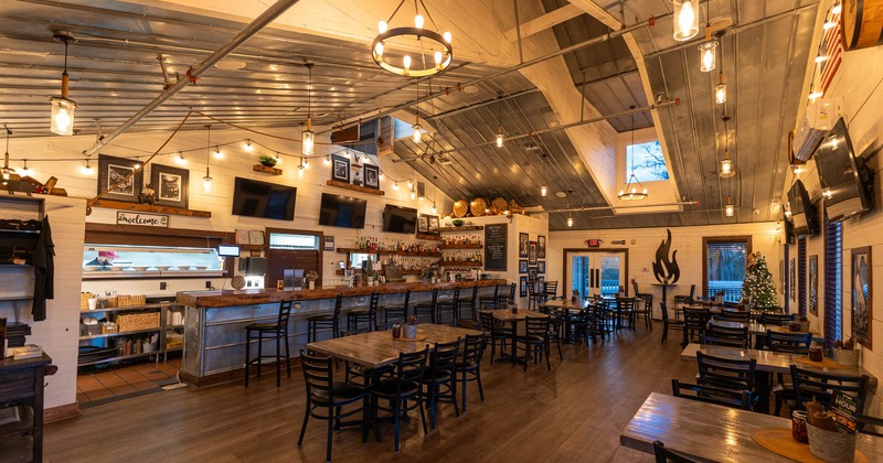 Interior, seating area and a bar, TVs on the walls