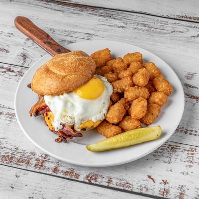 Day Break burger served with tater tots and a pickle