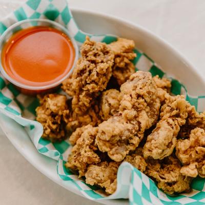 Fried chicken livers served with dipping sauce.