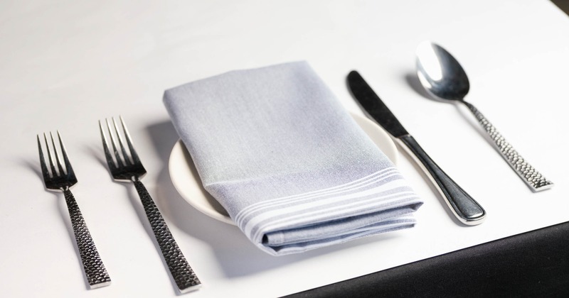 Interior, detail of a table set for guests