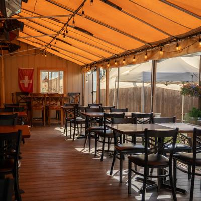 Tables and chairs on the covered patio.