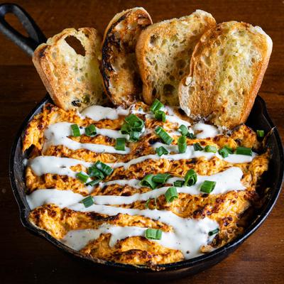Buffalo Dip with toasted baguette.