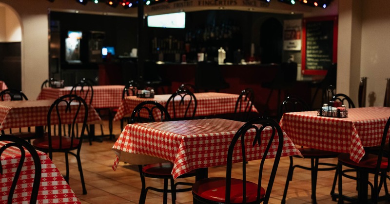 Interior, tables and chairs in dining area