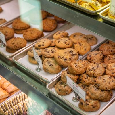 Bakery display case filled with assorted cookies.