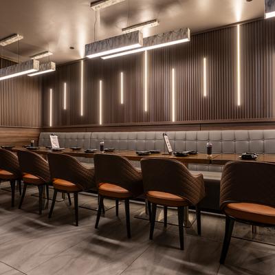 Interior, banquette with set dining tables and chairs.