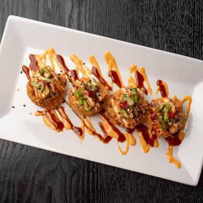 Crispy Spicy Tuna Rice Bites served on a plate, overhead view.