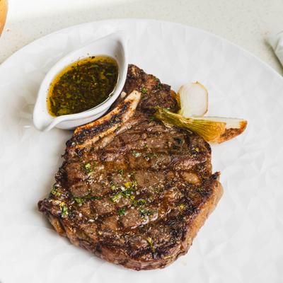 Carne Asada, Mexican rice, chambray onions, roasted jalapeños, chimichurri.