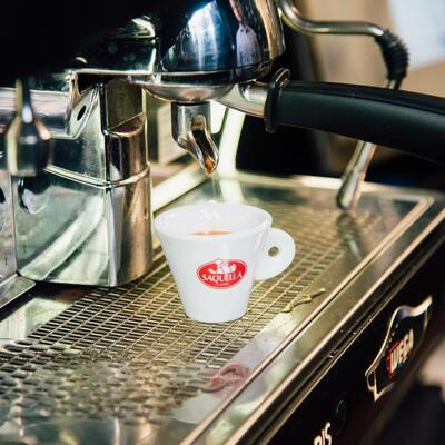 Staff member preparing coffee