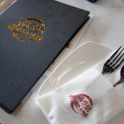 Table menu, a plate, napkin, and utensils.
