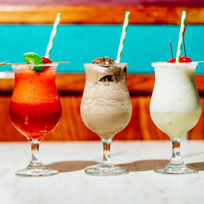 Strawberry Daiquiri, Choco_Banana,  and Pina_Colada lined up on the table.