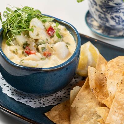 Scallop ceviche with a side of tortilla chips.