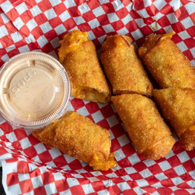 Southwest egg rolls served with dipping sauce.