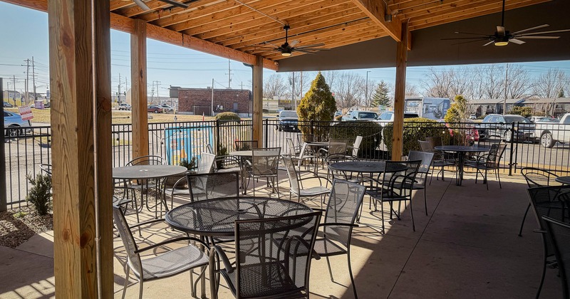 Exterior seating area with tables and chairs
