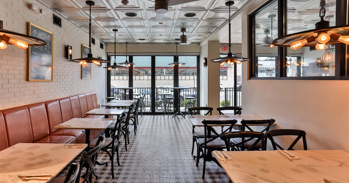 Interior dining area with large windows behind
