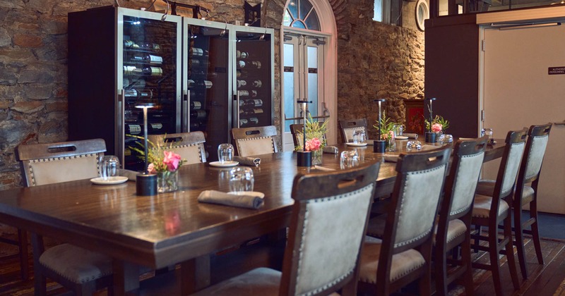 Interior, long table ready for guests