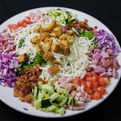 Club Salad, with ham, turkey, bacon, tomato, onion, romaine, mozzarella, and croutons.
