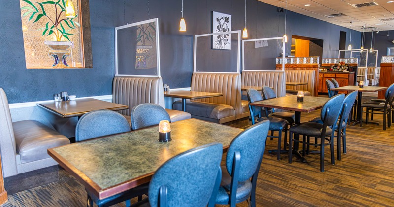 Interior, seating area with booths, tables and chairs