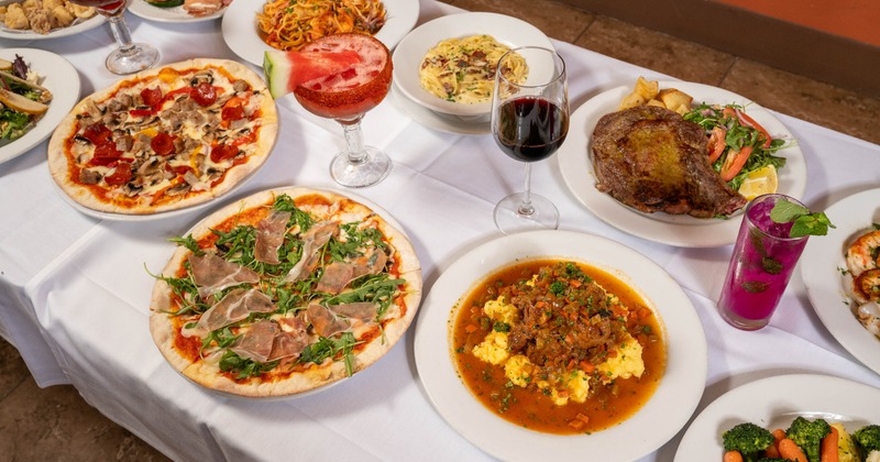 A large spread of Italian dishes and drinks