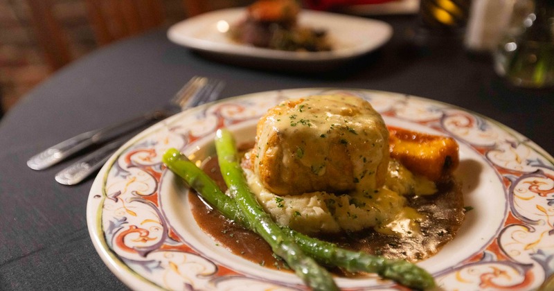 Beef Wellington steak with asparagus and mashed potatoes