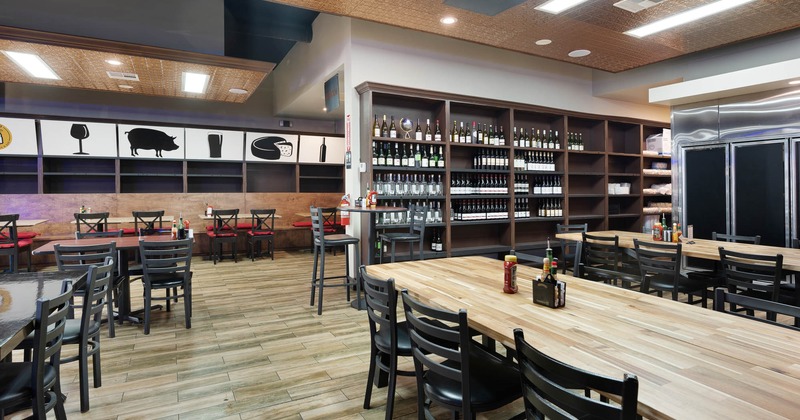 Elegant interior with dining tables and wine shelves