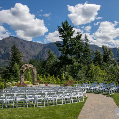 Wedding arch,chairs for the guest,path to the arch