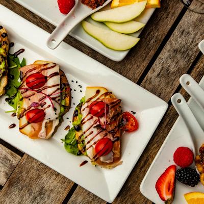 Avocado Crostini and other dish plates, top view