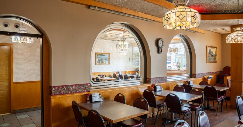 Diner tables, chairs, arches as a partition wall