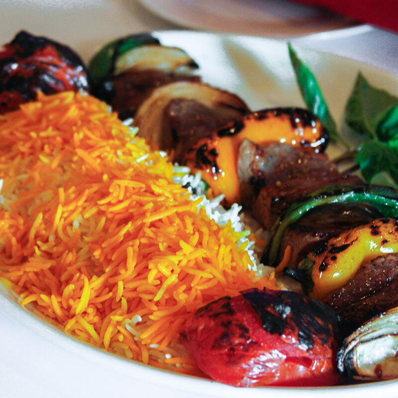 Grilled veggies and meat skewers with rice