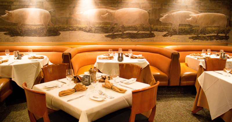 Interior, tables with cutlery and wine glasses