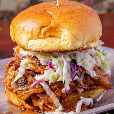 Burger with pulled pork and coleslaw.