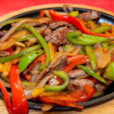 Beef Fajitas, with grilled bell peppers, and onion.