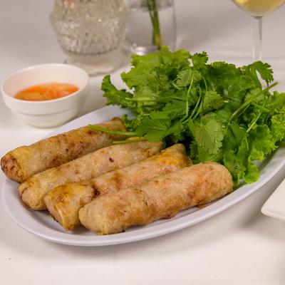 Crispy Imperial Rolls with lettuce, mint, cilantro and dipping sauce.