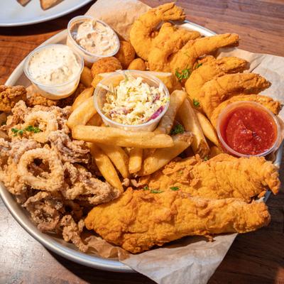 Fried Seafood Platter with fish, shrimp, calamari, oysters, scallops and sides.