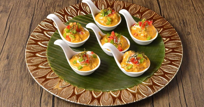 Bang shrimp served in traditional tasting spoons on a plate