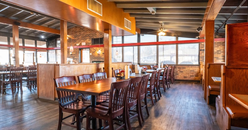 Interior dining area, long tables ready for guests