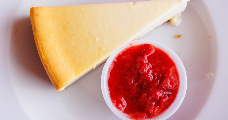 Cheesecake with a side of  Strawberry topping