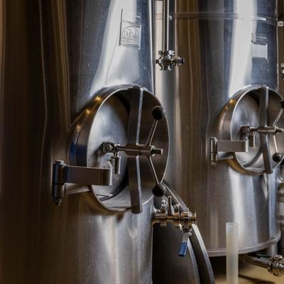 Stainless steel brewing tanks.