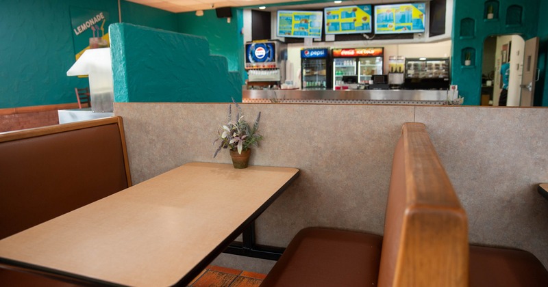 Interior of a restaurant with brown booth seating