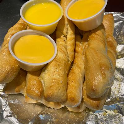Breadsticks, with cheese dip.