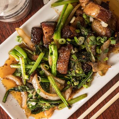 Stir-fry crispy pork belly with rice.