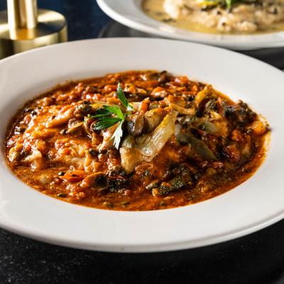 Chicken breast sauteed with vegetables and mushrooms in a sherry wine sauce.